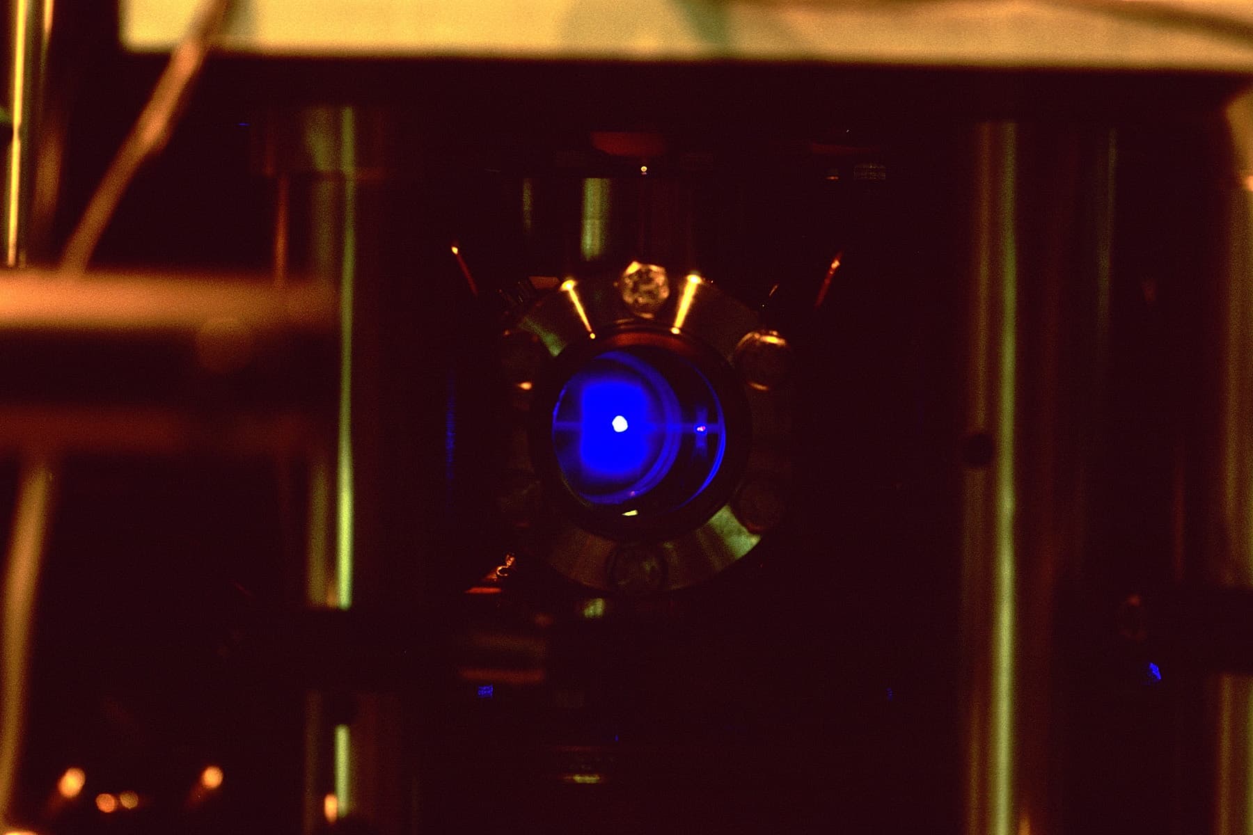 JILA's strontium optical lattice atomic clock, a glowing blue dot of trapped strontium atoms inside a vacuum chamber